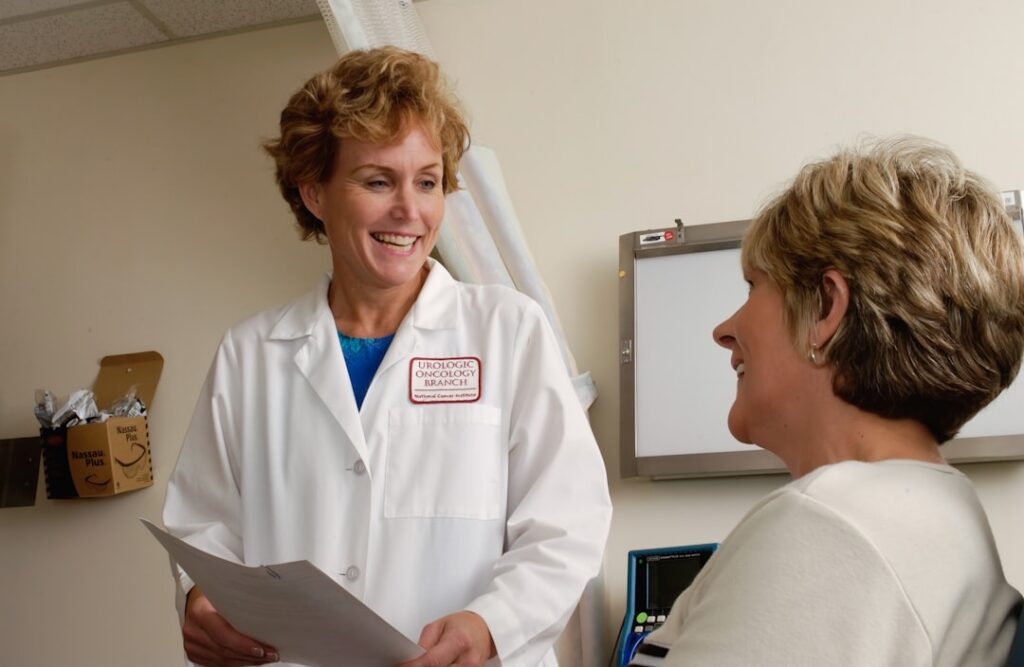 Doctor speaking with a patient during a skin health consultation